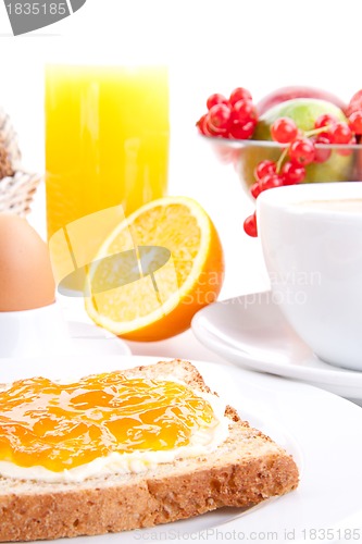 Image of breakfast table with toast and orange marmelade isolated