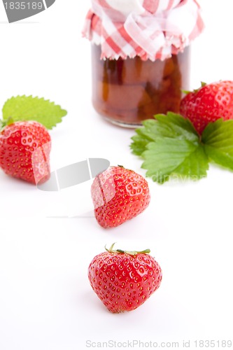 Image of deliscious strawberry jam with fresh fruits isolated