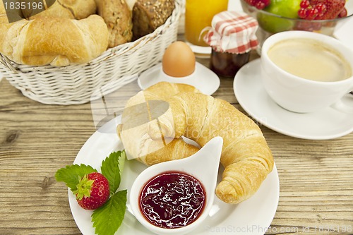 Image of traditional french breakfast on table in morning