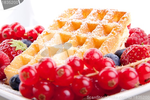 Image of sweet fresh tasty waffles with mixed fruits isolated