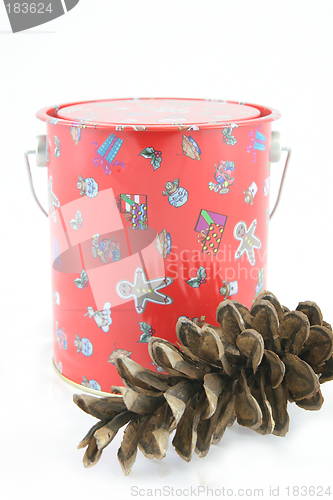 Image of Christmas tin with pine cone