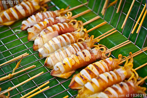 Image of Grilled squids on market