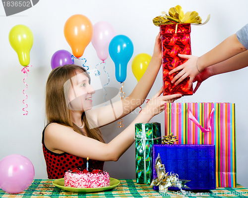 Image of Birthday. The girl accepts gifts