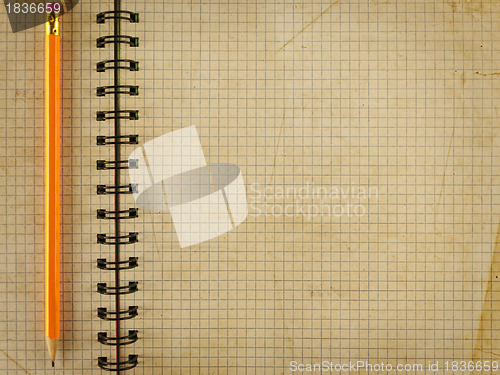 Image of notepad notebook with pencil 