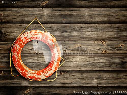 Image of lifebuoy at wooden background