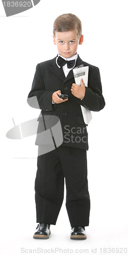 Image of Boy holding a cellphone and newspaper