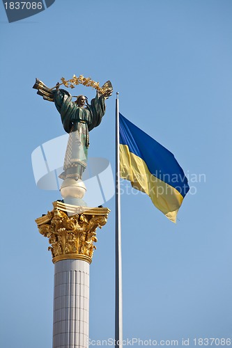 Image of The Independence monument and ukrainian flag in Kiev, Ukraine, E