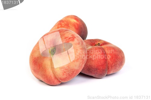 Image of Three ripe fig peach on white