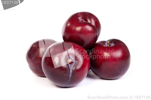 Image of Group of plums  on white
