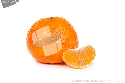 Image of Ripe tangerine or mandarin with slices on white