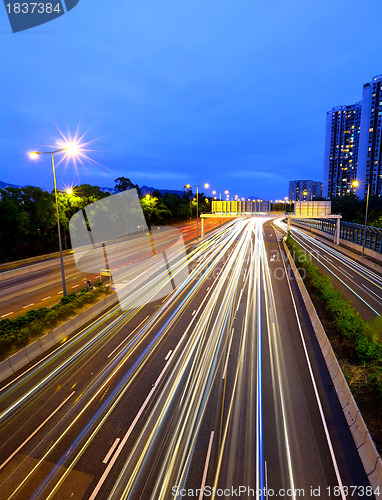 Image of highway and traffic in city at night