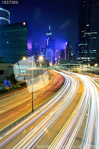 Image of city in night with busy traffic