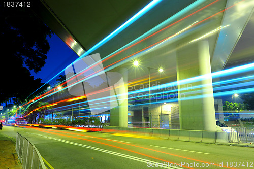 Image of city in night with busy traffic