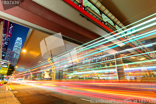 Image of city in night with busy traffic