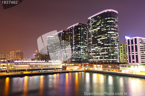 Image of office buildings at sea coast at night