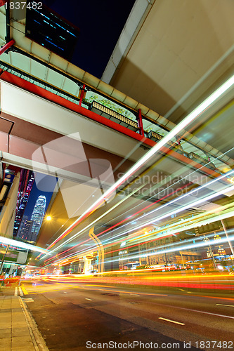 Image of city in night with busy traffic