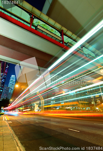 Image of city in night with busy traffic