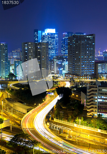 Image of highway and traffic in city at night