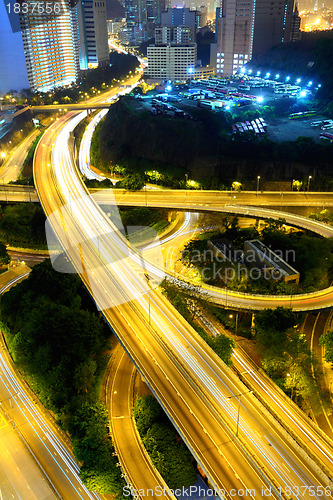 Image of city in night with busy traffic