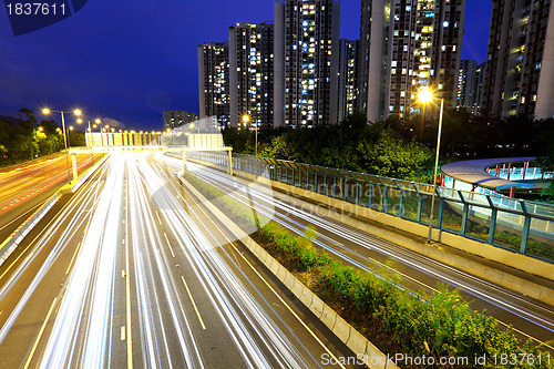 Image of city in night with busy traffic