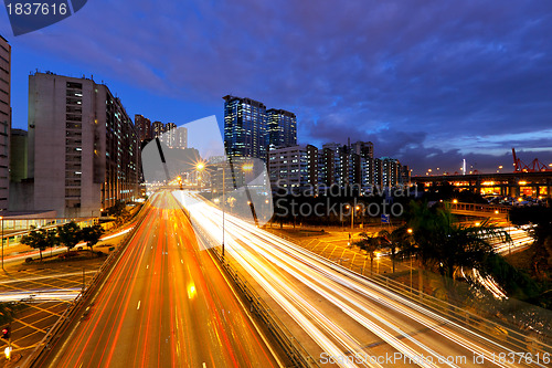 Image of city in night with busy traffic
