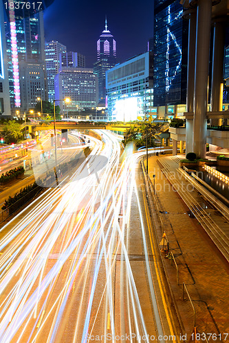 Image of city in night with busy traffic