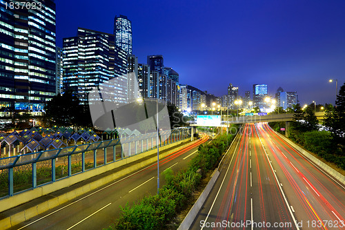 Image of city in night with busy traffic