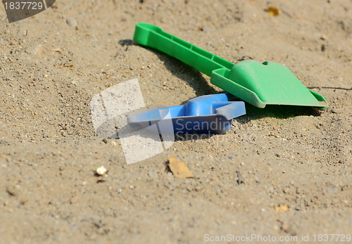 Image of toys in the sand