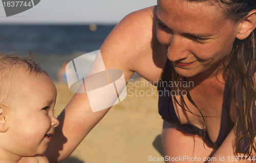 Image of Mother and Baby enjoying beach