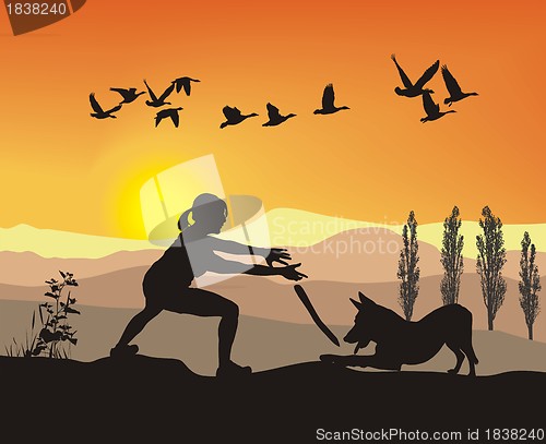 Image of Woman is played With Dog in nature