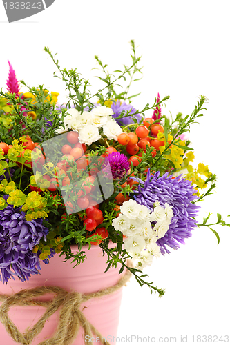 Image of Summer bouquet of flowers and berries closeup. 