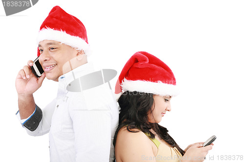 Image of Happy Christmas people back to back isolated on white 