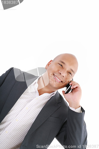 Image of Business man talking on cell phone. Pleasant Look. One White. Bu