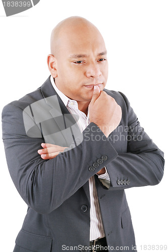 Image of Thinking businessman in a suit isolated on white background 