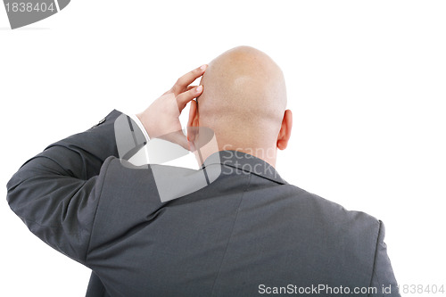 Image of Handsome young business man in modern elegant suit standing back