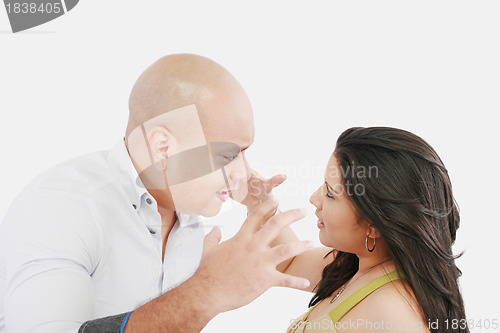 Image of Studio shot of a young couple fighting 