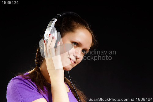 Image of smiling girl in the headphones