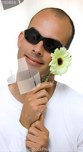 Image of Man with a beautiful yellow flower