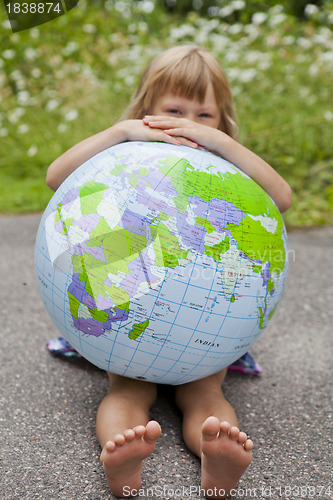 Image of Girl holding an earth globe