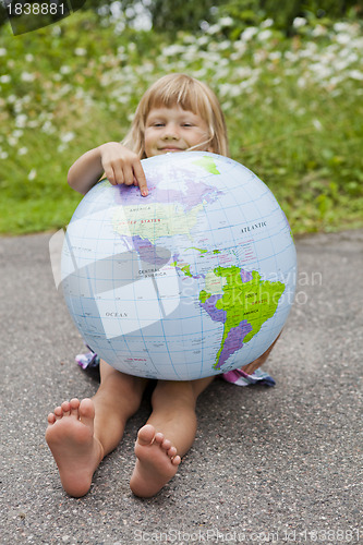 Image of Girl holding an earth globe