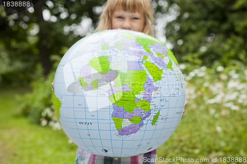 Image of Girl holding an earth globe