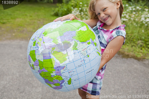 Image of Girl holding an earth globe