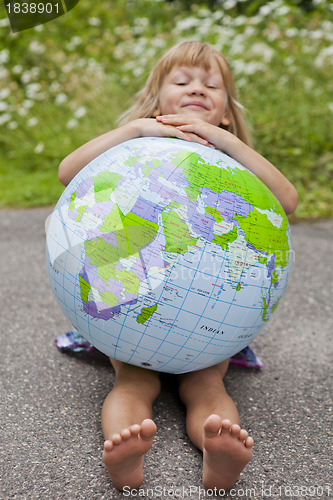 Image of Girl holding an earth globe