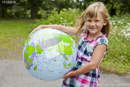 Image of Girl holding an earth globe