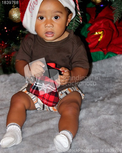 Image of Portrait of Black baby in santa hat