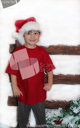 Image of Little boy in red shirt at Christmas