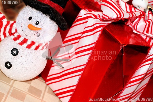 Image of Pretty wrapped Christmas box with snowman