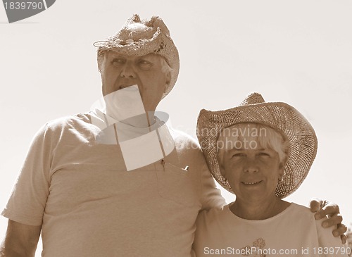 Image of Senior man and woman with hats