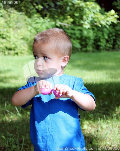 Image of Little boy in blue with Easter candy