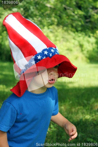 Image of Little boy wearing big 4th of July hat
